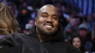Kanye West smiles