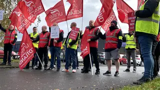 Workers on a picket line outside the Co-op Funeralcare coffin factory in Glasgow