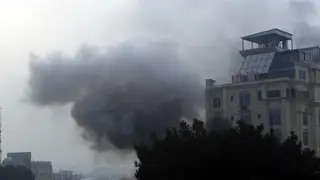 Smoke rises from a hotel after an explosion and gunfire in the city of Kabul, Afghanistan