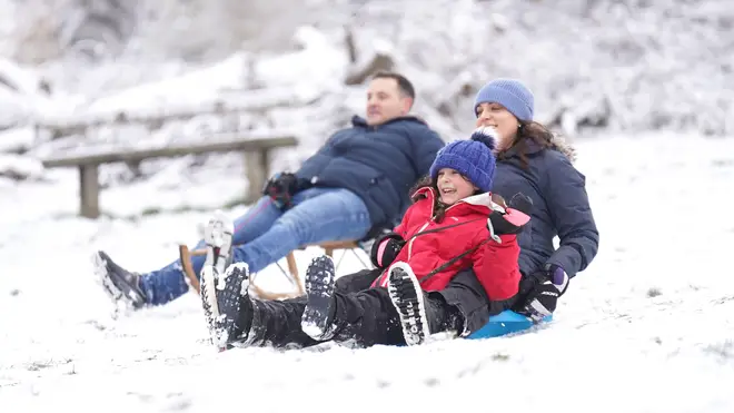 People sledging in Richmond Park in south west London