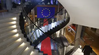 A man walks down stairs during a special session on lobbying at the European Parliament in Strasbourg, eastern France