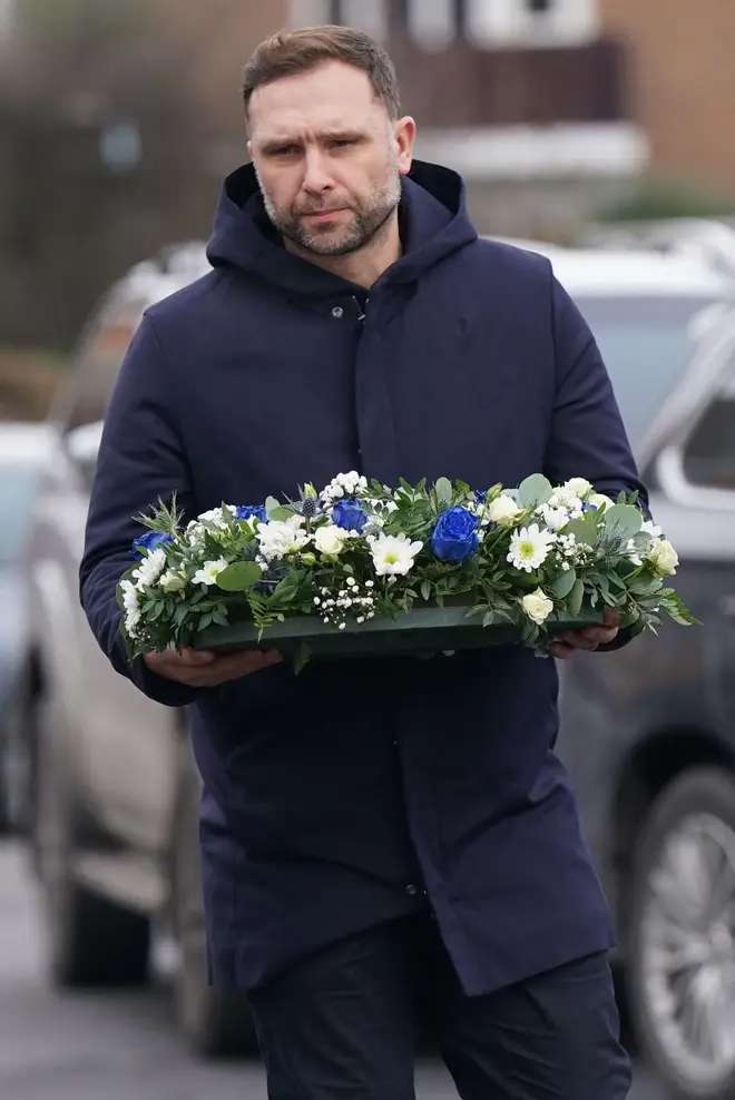 Birmingham City Football Club head coach John Eustace lays flowers