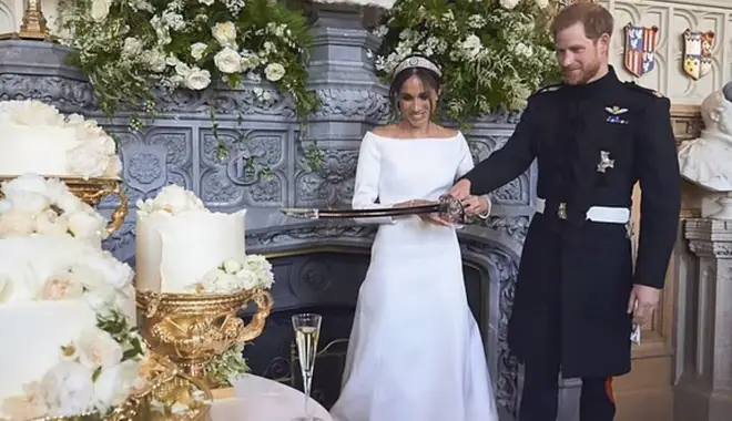 Harry and Meghan cut the wedding cake with a sword