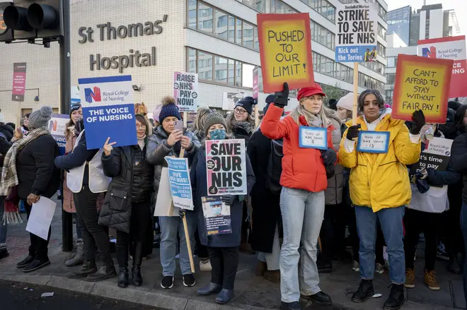 Nurses striking outside St Thomas' Hospital in London