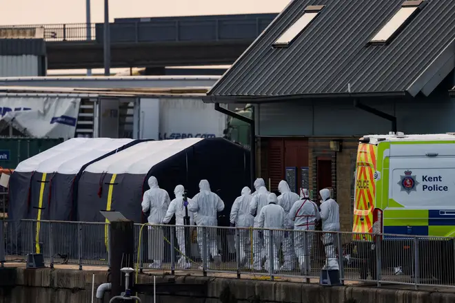 Forensics officers are pictured at Dover after the tragedy on December 14