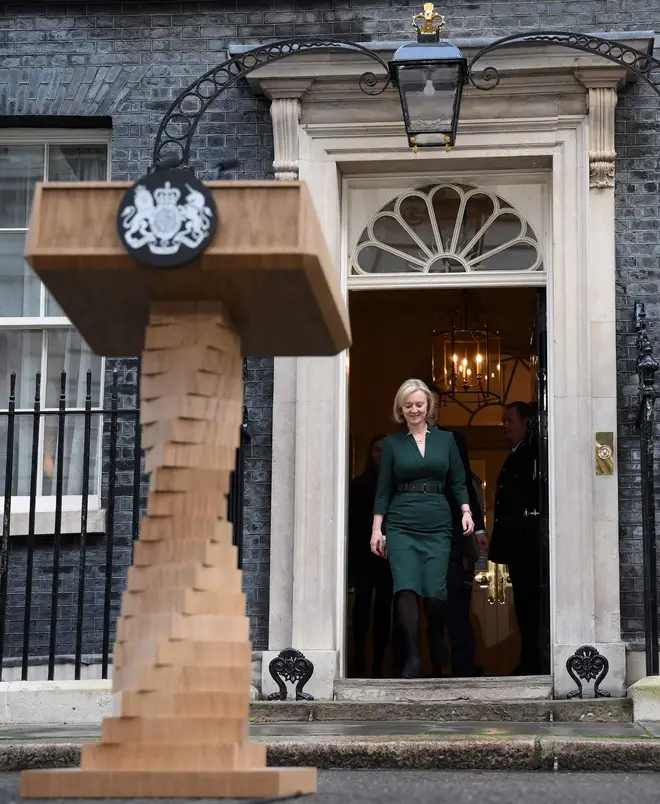 Britain's outgoing Prime Minister Liz Truss arrives to deliver her final speech outside 10 Downing Street in central London, before heading to Buckingham Palace to give her resignation.