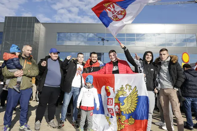 Supporters of deported Serbian tennis player Novak Djokovic gather at the Nikola Tesla Airport on January 17, 2022 in Belgrade, Serbia. (Photo by Srdjan Stevanovic/Getty Images)