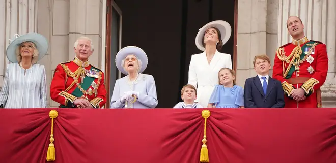 The Queen watches the flypast with other senior royals on the Buckingham Palace balcony.