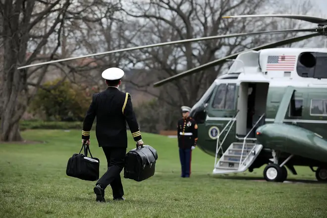 A White House military aide carries the nuclear "football"