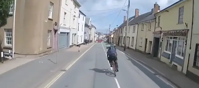 The cyclist in the middle of the road