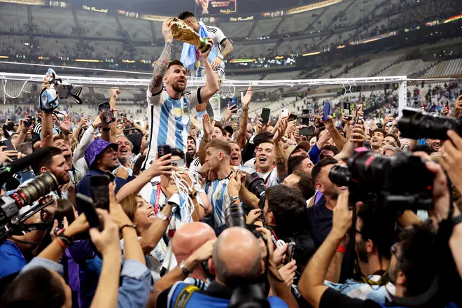Argentina talisman Lionel Messi lifts the World Cup trophy.