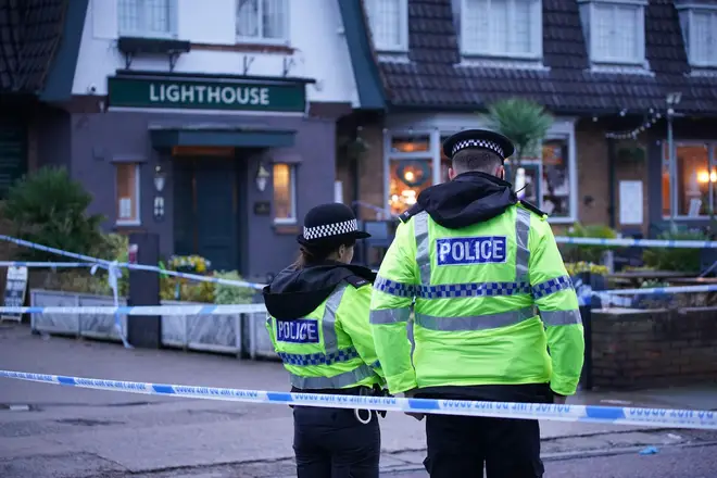 Police officers on duty at the Lighthouse Inn in Wallasey Village, near Liverpool, December 25, 2022.