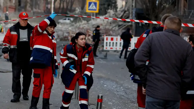 Paramedics arrive at scene after rockets fired by Russian forces hit the centre of Ukrainian capital Kyiv