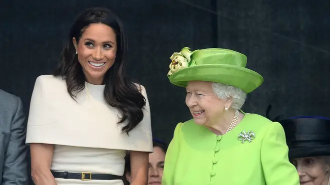 Meghan and the Queen smile together during a public appearance