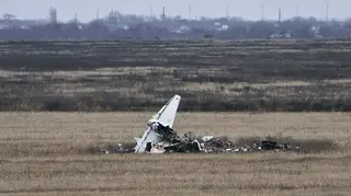 Fragments of a military plane are seen near Kherson, Ukraine