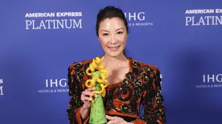 Michelle Yeoh poses backstage with the international star award by an actress for Everything Everywhere All At Once at the 34th annual Palm Springs International Film Festival Awards Gala on Thursday