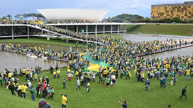 Supporters of ex-president Jair Bolsonaro storm the Esplanada dos Ministerios