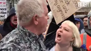 One protester screams at a Donald Trump Supporter.