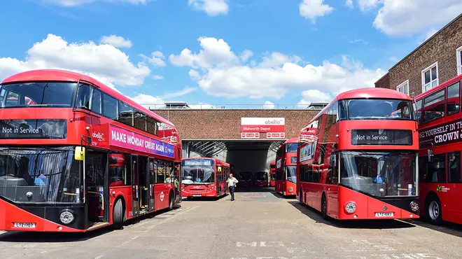 Red Abellio buses parked at bus garage