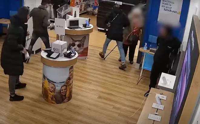 One thief nearly knocked over an elderly woman after stealing the phones