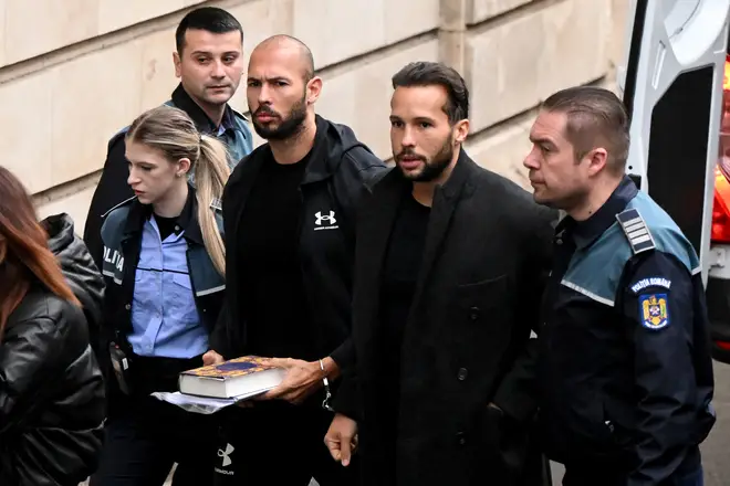 Andrew Tate (3rd R) and his brother Tristan (2nd R) arrive handcuffed and escorted by police at a courthouse in Bucharest on January 10, 2023 for a court hearing on their appeal against pre-trial detention.
