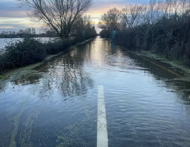 : Flood water surrounds the A361 road in Somerset