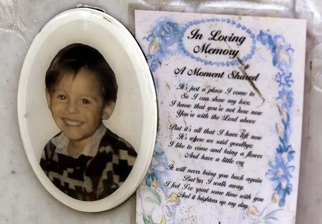 A message lies behind a picture of murdered toddler James Bulger