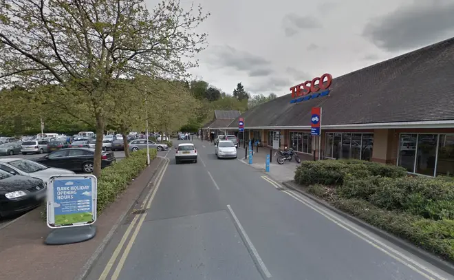 A woman has been arrested on suspicion of murder after a man in his 60s died following the suspected robbery of his mobility scooter in a Tesco car park, Gloucestershire Police said.