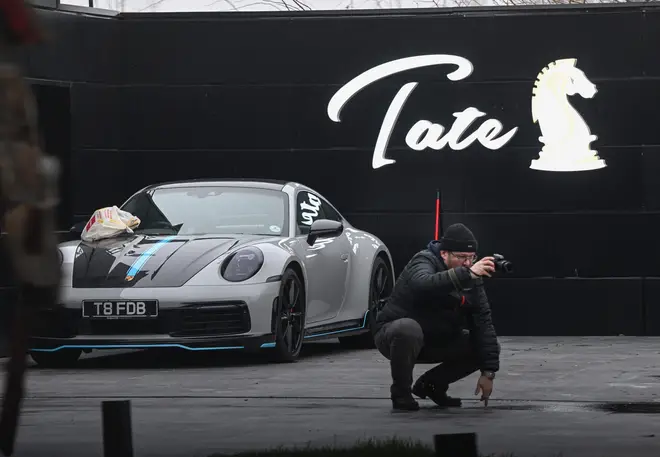 A car is pictured at "The Hustlers University" site belonging to influencer Andrew Tate