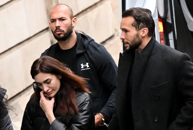 Andrew Tate and his brother Tristan arrive handcuffed and escorted by police at a courthouse in Bucharest on January 10