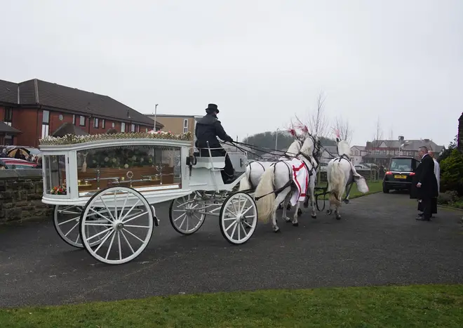 A horse drawn carriage at Elle Edwards' funeral