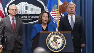 US deputy attorney general Lisa Monaco, flanked by attorney general Merrick Garland, left, and FBI director Christopher Wray, speaks during a news conference to announce an international ransomware en