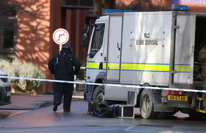 A member of the bomb disposal unit wearing protective equipment.