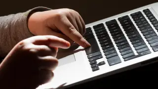 A child using a laptop computer (Dominic Lipinski/PA)