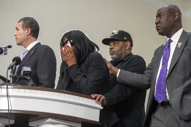 Mr Nichols' mother, RowVaugn Wells, second from left, becomes emotional during a press conference at Mt. Olive Cathedral CME Church after she viewed footage of the violent police interaction that led to his death