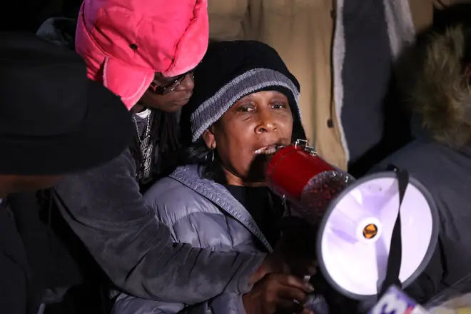 RowVaughn Wells speaks to attendees during the candlelight vigil