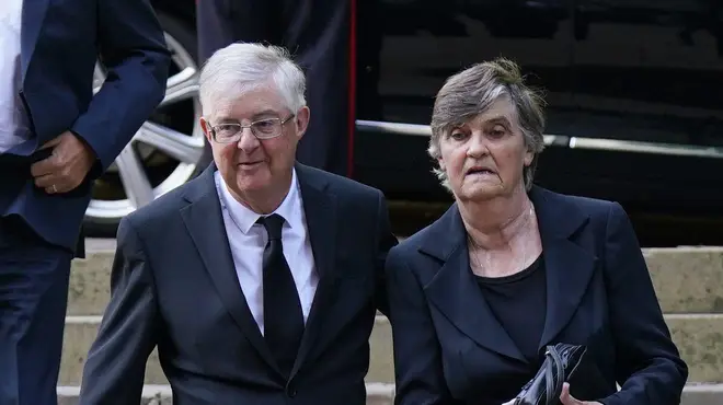 Mark Drakeford and wife Clare arrive at a service for Queen Elizabeth in September 2022