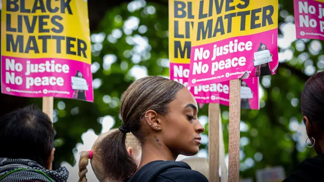 A young woman is pictured at a Black Lives Matter protest in London last September