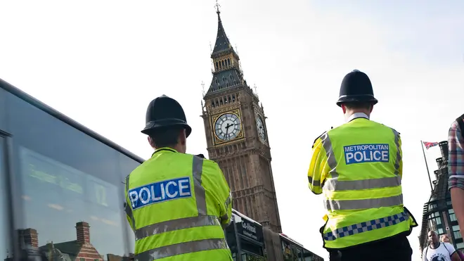 A pair of Metropolitan Police officers look on at Big Ben