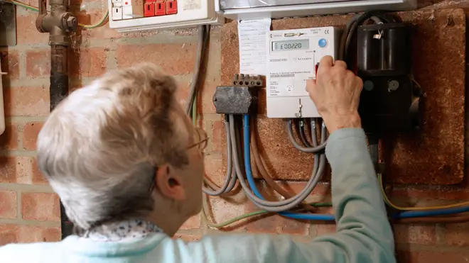 Elderly woman using a quantum key prepayment electric meter