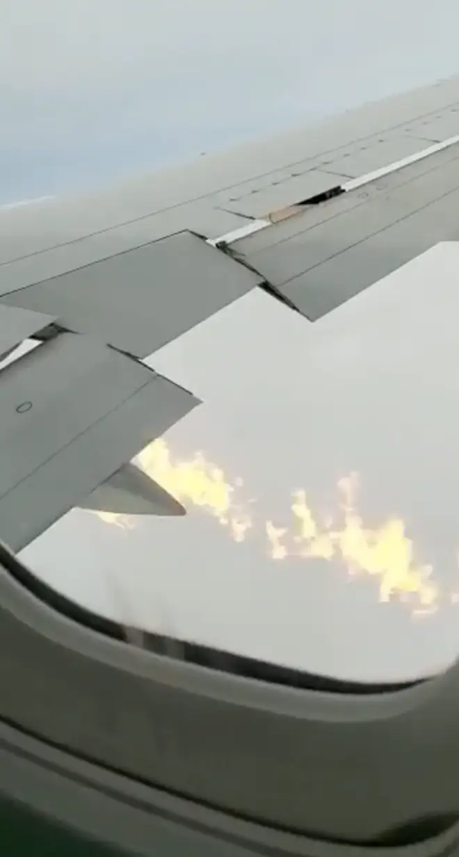 The plane's wing caught fire
