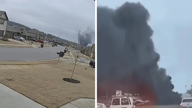 Footage shows a black plume of smoke coming from the crash