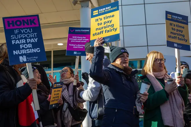 Nurses hold signs at an official picket line outside the Royal Berkshire Hospital on 6 February 2023 in Reading, United Kingdom.