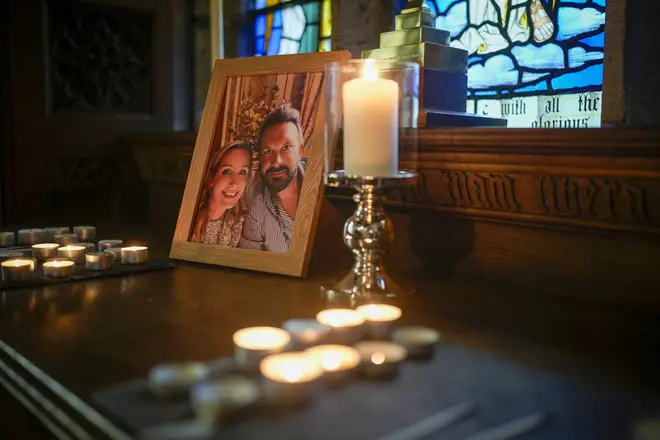 Candles illuminate a photo of missing woman Nicola Bulley and her partner Paul Ansell at St Michael's Church in St Michael's on Wyre