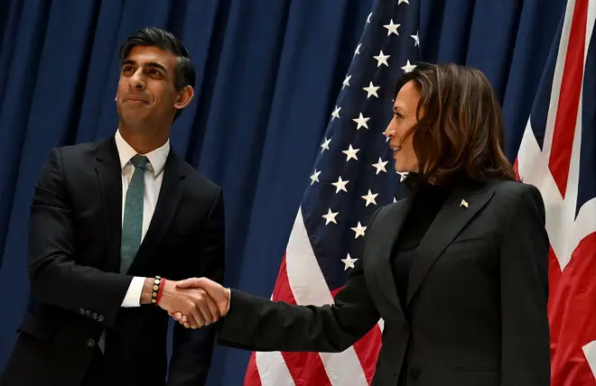 Britain's Prime Minister Rishi Sunak (L) shakes hands with US Vice President Kamala Harris as they meet at the 59th Munich Security Conference (MSC) on February 18, 2023 in Munich, southern Germany.