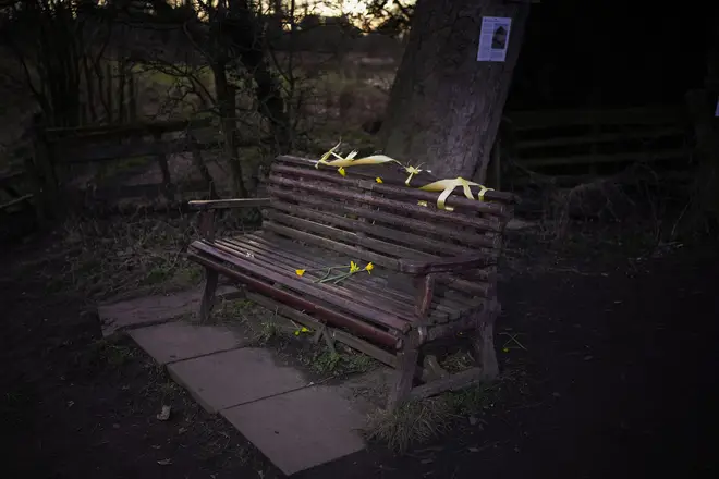 Yellow ribbons and daffodils adorn the bench where the phone of missing Nicola Bulley was found, on the banks of the River Wyre in St Michael's on Wyre
