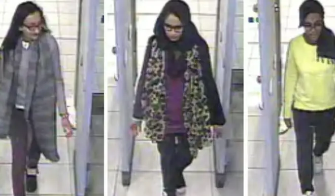 Begum, centre,  fleeing the UK through Gatwick Airport in 2015 with two other girls