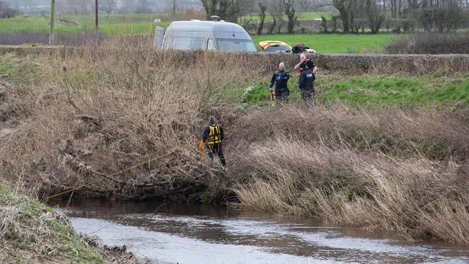 A police diving team at the River Wyre near St Michael's on Wyre where the body was found