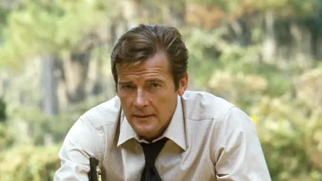 Roger Moore poses on the set of Live and Let Die
