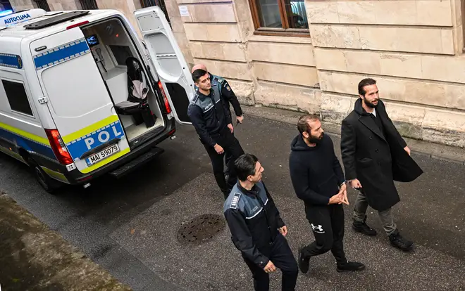 Andrew Tate (2nd R) and his brother Tristan Tate (R) arrive at The Court of Appeal in Bucharest, Romania, on February 27, 2023.